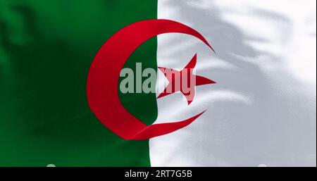 Close-up of national flag of Algeria waving on a clear day. two vertical bars, green and white, with a red star and crescent in the center. 3d illustr Stock Photo