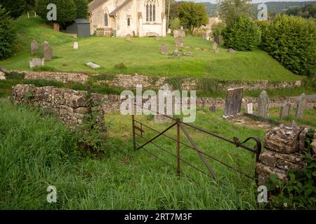 The landscape looking from the village cemetery to the church of St John the Apostle (1820) in the Cotswolds village of Sheepscombe, on 8th September 2023, near Stroud, England. The Sheepscombe Valley was once part of a Royal Deer Park used by King Henry VIII and since the early 17th century, Sheepscombe was involved in cloth making like many of the Cotswold towns in the area and its near neighbour Painswick. Stock Photo