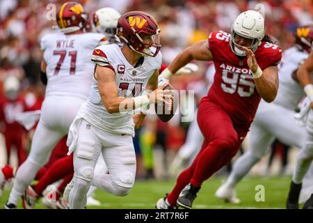 Arizona Cardinals defensive tackle Leki Fotu (95) looks up at a replay  during an NFL football game against the Cincinnati Bengals, Friday, Aug.  12, 2022, in Cincinnati. (AP Photo/Zach Bolinger Stock Photo - Alamy