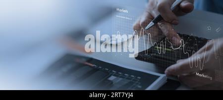 close up Businessmen work with stock market investments using calcurator to analyze trading data. smartphone with stock exchange graph on screen. Fina Stock Photo