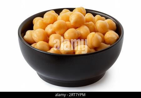 Cooked chick peas in a black ceramic bowl isolated on white. Stock Photo
