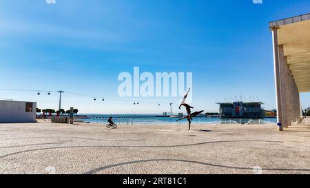 Parque das Nacoes district, Parque das Nacoes, Park of Nations with Rhizome II sculpture, cable car and oceanarium on the horizon, former Expo Stock Photo