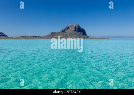 View over the turquoise waters of the lagoon to Le Morne Brabant in the southwest of Mautitius Stock Photo