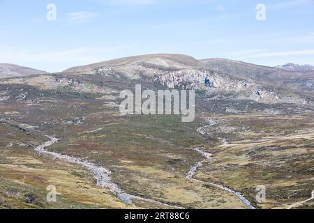 The majestic view towards Mount Kosciuszko from Charlotte Pass lookout on a clear autumn day in New South Wales, Australia Stock Photo