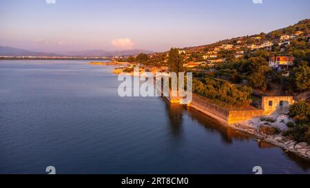 Aerial drone view of the beautiful landscape of Shiroka Lake at sunset near Shkoder. Albania Stock Photo