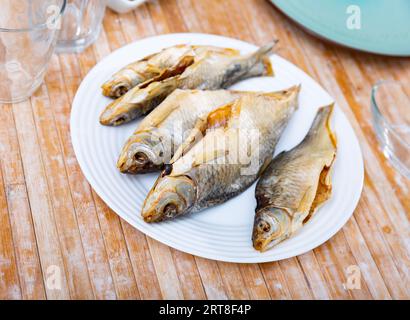 Dried roaches served on wooden table Stock Photo