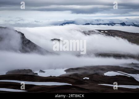Clouds slowly covering Iceland snowy mountain landscape - view from the slope of Snaefellsjokull volcano. Stock Photo