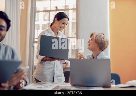 Group of professional business managers working with documents in office and use laptop Stock Photo