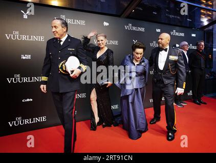 AMSTERDAM - Geert-Jan Knoops and Carry Knoops and Marco Kroon and Mirjam van den Hoven on the red carpet at the premiere of the film De Vuurlinie in the Royal Theater Tuschinski. The film is based on the stories of Major Marco Kroon, the first soldier since 1955 to be awarded the Military Order of William. ANP RAMON VAN FLYMEN netherlands out - belgium out Stock Photo