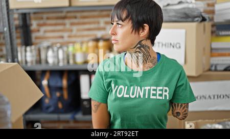 Hispanic Woman With Amputee Arm Volunteer Smiling Confident Sitting On ...