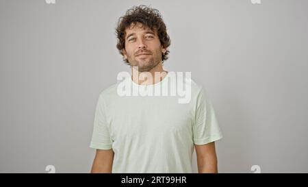 Young hispanic man doctor looking xray over isolated white background Stock Photo