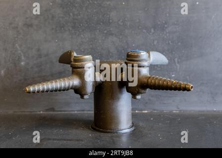 Gas valve on a black resin lab table in a high school science classroom. Stock Photo