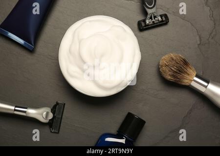 Set of men's shaving tools on black textured table, flat lay Stock Photo