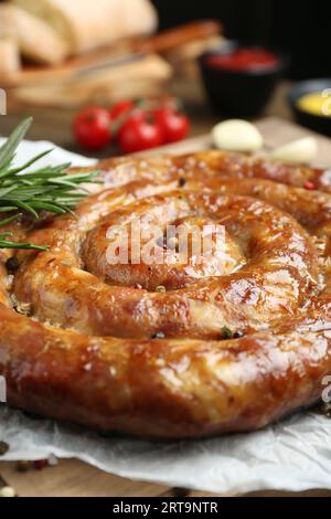 Delicious homemade sausage with spices on table, closeup Stock Photo