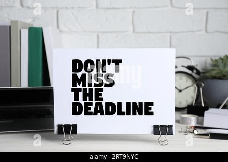 Reminder Don't Miss The Deadline on office desk Stock Photo