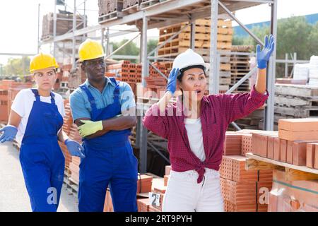 Taskmaster amazed by something in outdoor warehouse Stock Photo