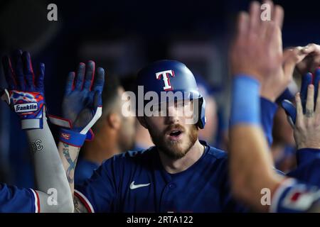 Texas Rangers catcher Jonah Heim reacts after striking out during