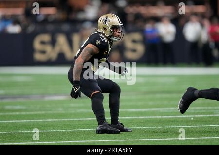 New Orleans, Louisiana,, November 7, 2022. New Orleans Saints safety Tyrann  Mathieu (32) tackles Baltimore Ravens quarterback Lamar Jackson (8) during  a National Football League game at Caesars Superdome in New Orleans