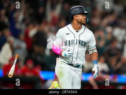 Seattle Mariners' Ty France flips his bat after hitting a home run