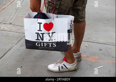 New York City Manhattan Sidewalk On 6th Avenue And Woman Carrying Victorias  Secret And Jcpenney Shopping Bag Stock Photo - Download Image Now - iStock