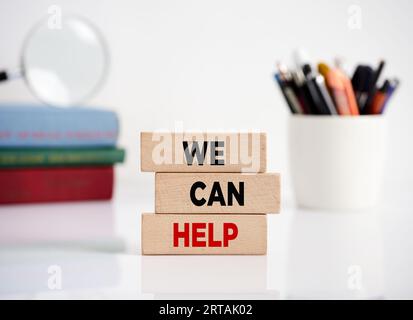 Can help, message on wooden blocks on white background Stock Photo - Alamy