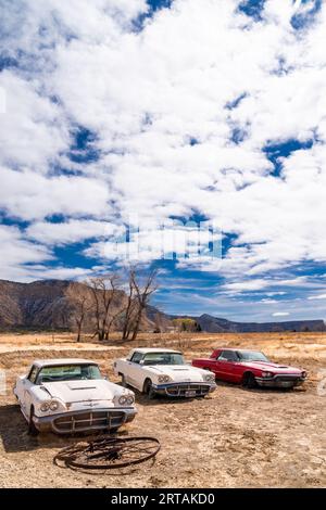 Three abandoned cars outside a pawn shop in Cortez, Colorado. Stock Photo
