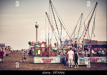 Fun fair on St Annes beach at end of summer Stock Photo