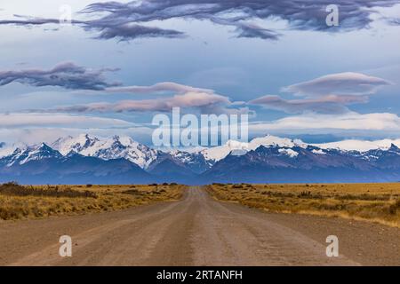 Panoramic view of the Cordillera de los Andes before sunrise along a gravel road with spectacular clouds, Argentina, Patagonia, South America Stock Photo