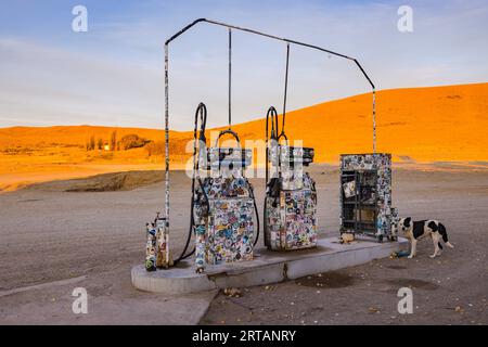 An old-fashioned sticker-covered gas station in the lonely pampas of Argentina, Patagonia, South America Stock Photo