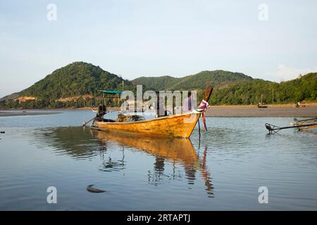 Koh Yao, Thailand; 1st January 2023: Fishermen fixing their long Tail boats in the fishing village of Koh Yao. Stock Photo