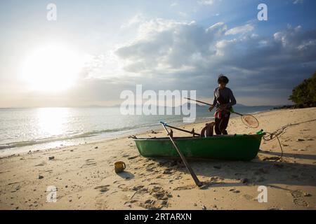 Koh Yao, Thailand; 1st January, 2023: A fisherman preparing his boat to go fishing for squid at night. Stock Photo