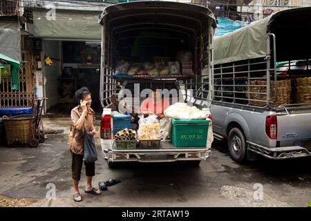 Bangkok, Thailand; 1st January 2023: Woman selling food in the back of a van. Stock Photo