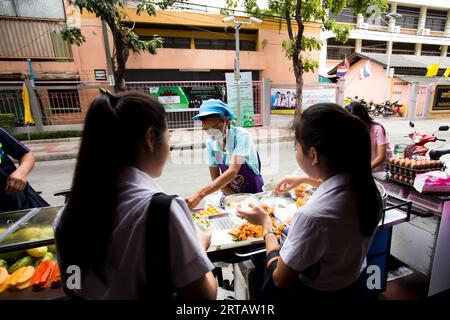 Bangkok, Thailand; 1st January 2023: Woman selling food on the streets of Bangkok. Stock Photo