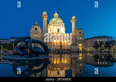 Sculpture by Henry Moore Hill Arches and the Karlskirche in Vienna at dusk, Austria, Europe Stock Photo