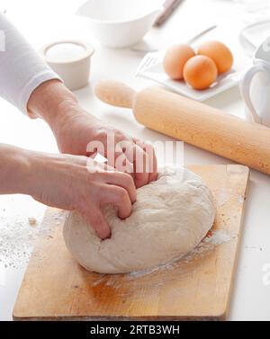 Hands of a person preparing pizza dough Stock Photo