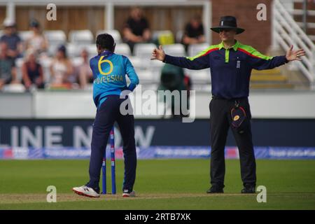 Chester le Street, 9 September 2023. Umpire James Middlebrook signaling wide ball during the First Metro Bank One Day International between England Women and Sri Lanka Women at Seat Unique Riverside. The bowler is Kavisha Dilhari. Credit: Colin Edwards Stock Photo