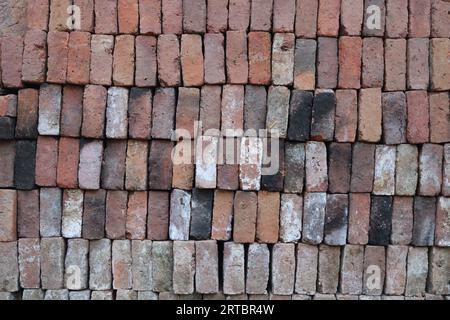 Pile of red clay bricks Stock Photo