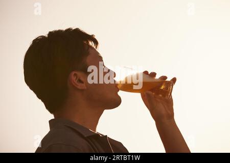 Japanese man drinking beer Stock Photo