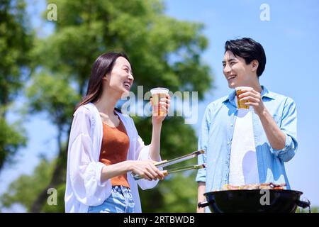 Japanese people having barbecue at city park Stock Photo