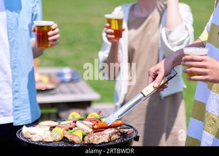 Japanese people having barbecue at city park Stock Photo