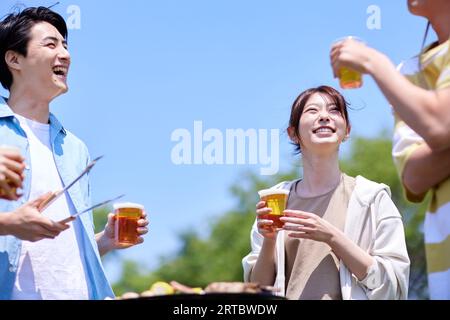 Japanese people having barbecue at city park Stock Photo