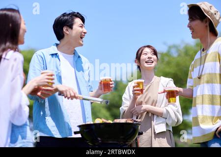 Japanese people having barbecue at city park Stock Photo