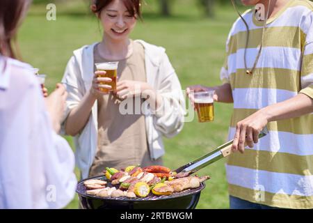 Japanese people having barbecue at city park Stock Photo