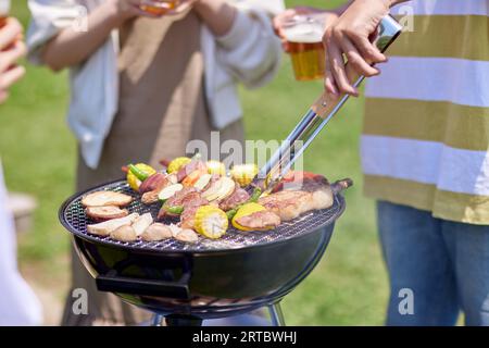 Japanese people having barbecue at city park Stock Photo