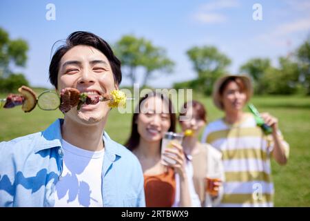 Japanese people having barbecue at city park Stock Photo