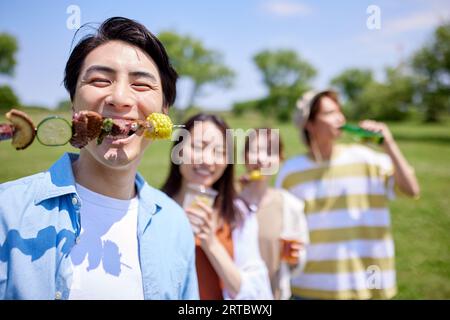 Japanese people having barbecue at city park Stock Photo