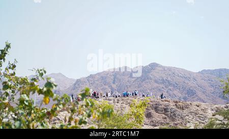 Mecca, Saudi Arabia - August 23, 2023: People visiting Uhud Mountain or Jabal Uhud in Mecca, Saudi Arabia Stock Photo