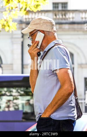 Older man using smartphone - Tours, Indre-et-Loire (37), France. Stock Photo