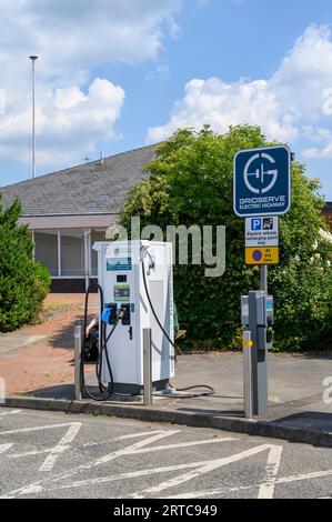 Electric vehicle chanrging point at motorway services in England. Stock Photo