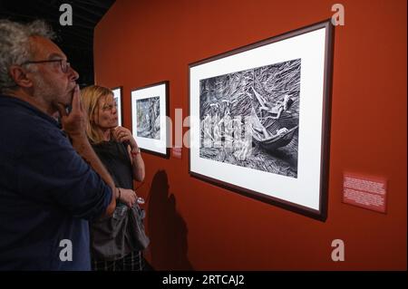 Madrid, Spain. 12th Sep, 2023. Visitors during the inauguration of the exhibition AMAZONIA by Sebastiao Salgado in Fernan Gomez Centro Cultural de la Villa of Madrid. Sebastiao Salgado undertook a photographic and human journey for seven years that led him to discover the most remote areas of the Amazon jungle and its inhabitants, showing more than 200 black and white photographs in the exhibition. Credit: Marcos del Mazo/Alamy Live News Stock Photo